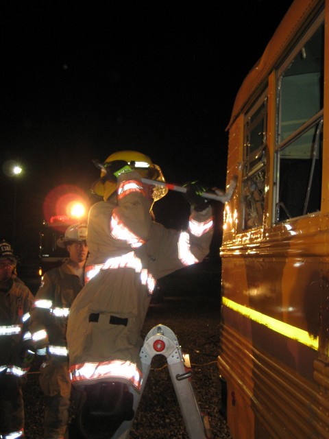 2nd Asst. Chief Llewellyn supervising Jr. FF McManus.                                                  
            School Bus Drill 10/22/07