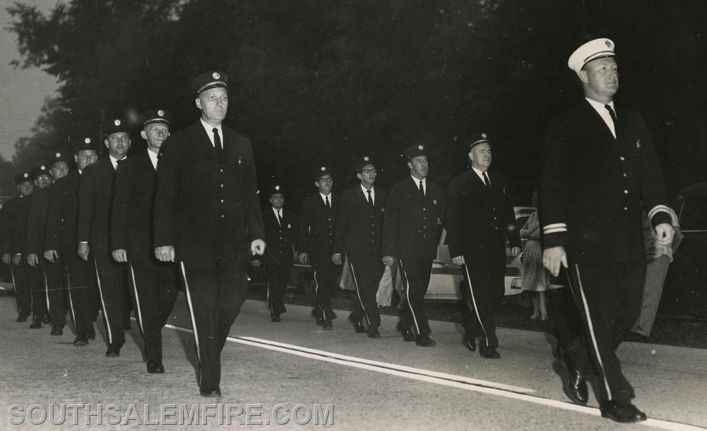 Chief Bischoff leading SSFD in a parade July 12, 1964